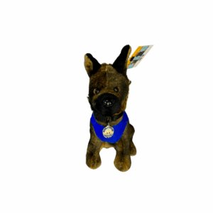 A small dog wearing a blue bandana looks up attentively.
