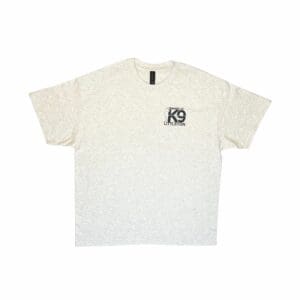 Beige t-shirt with a small black logo on the chest pocket area.
